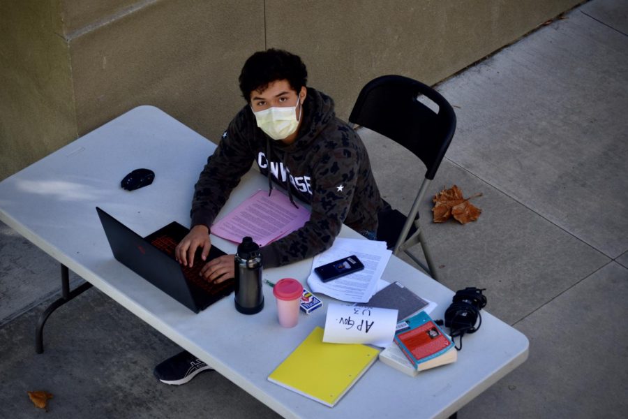 Junior Billy Rosas working at his designated table at school. 