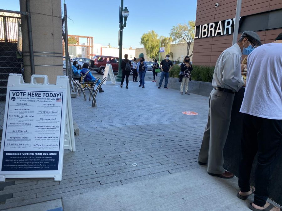 Voters wait in line to cast their ballots in Hayward on Nov. 3.