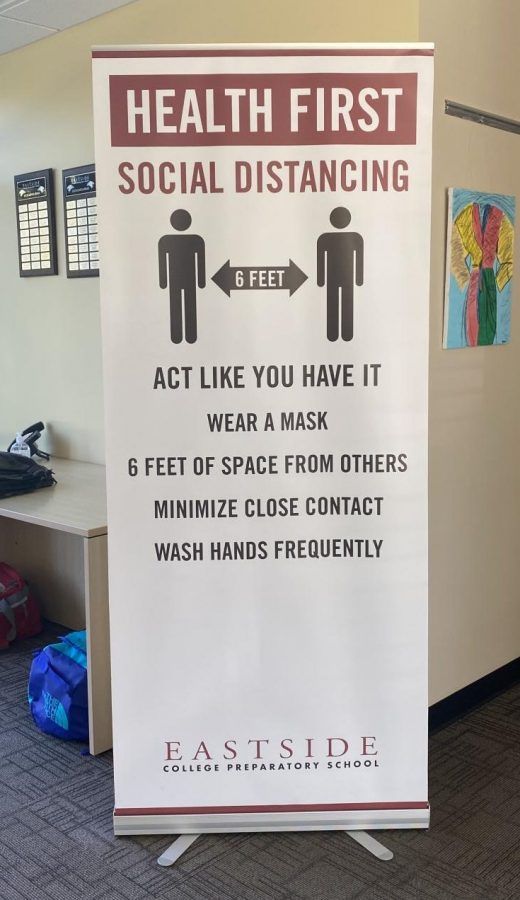 Banner in the front office informing students of Eastsides COVID protocols.