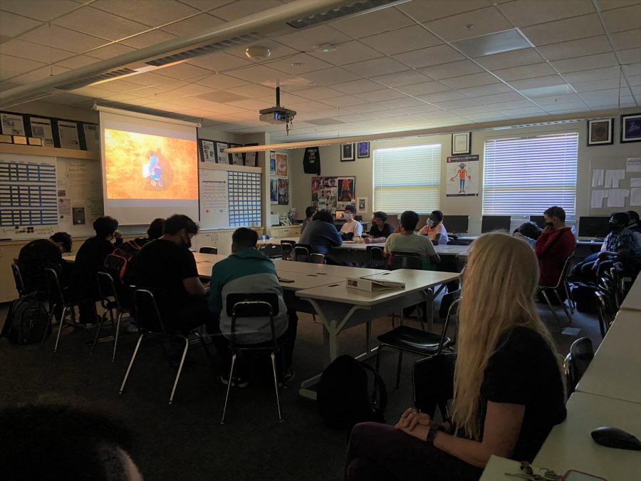 Students in room 114 watching Demon Slayer after school.