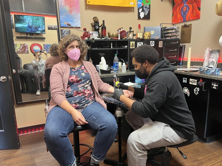English teacher Amy Reilly getting her tattoo.  Photo courtesy of Amy Reilly.