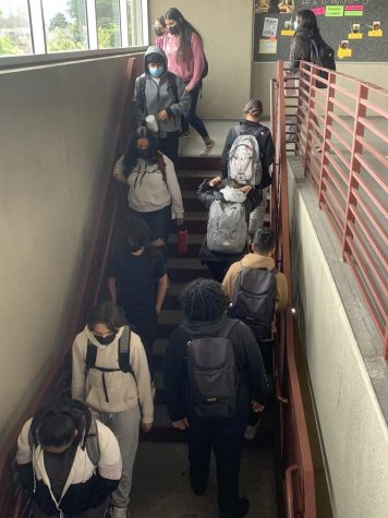 Students rush to classes after hearing the new warning bell.