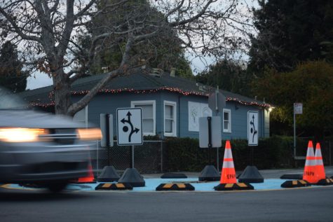On Dec. 9, A car drives through the new roundabout at Pulgas St. and Beech St. 